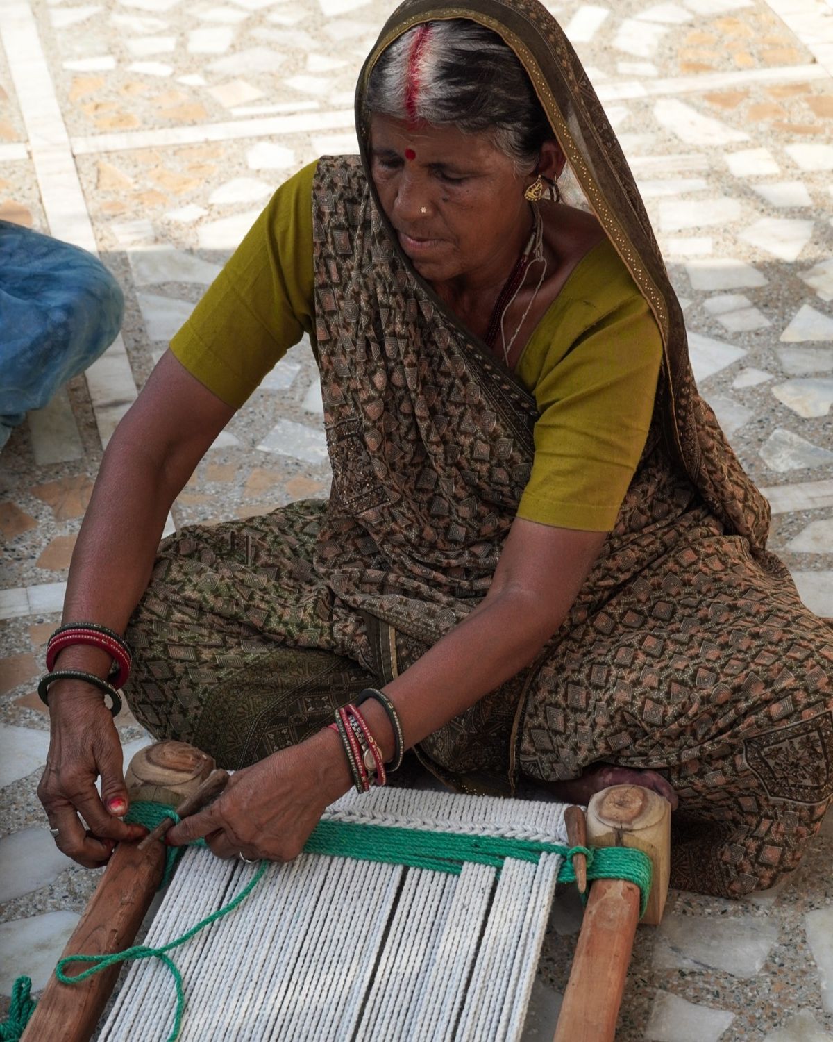 A weaver at work in a Bagru courtyard