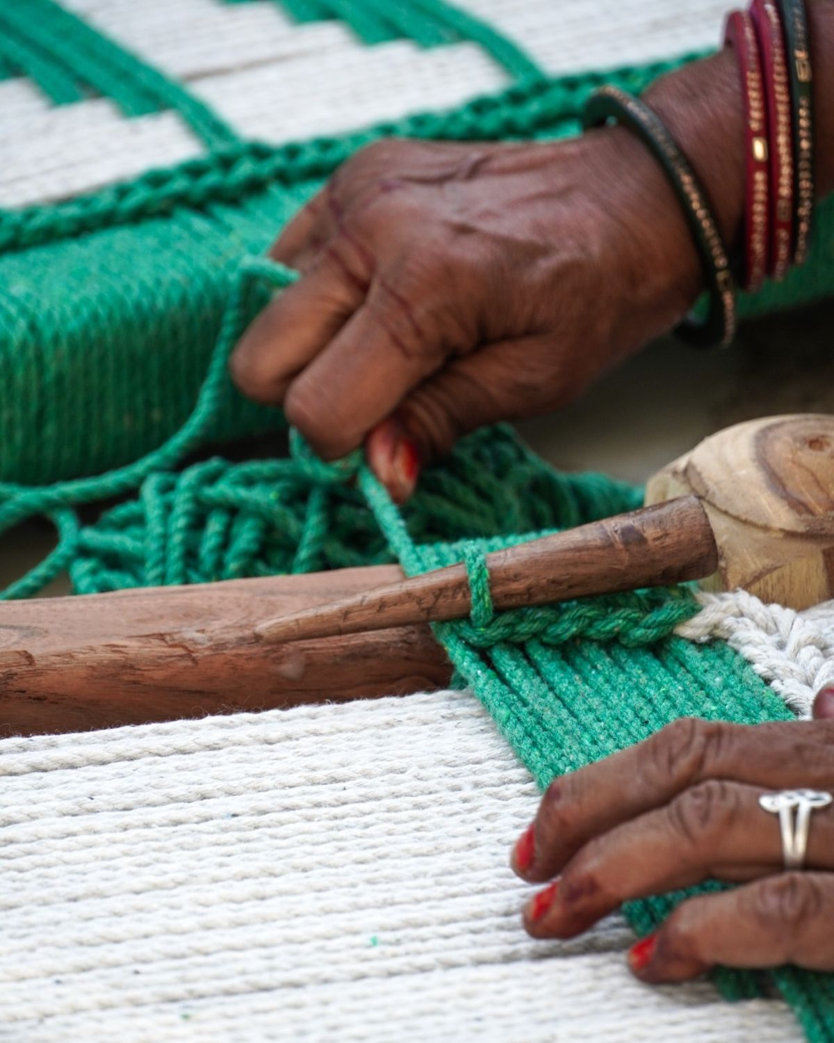 Artisan hands weaving natural fibre